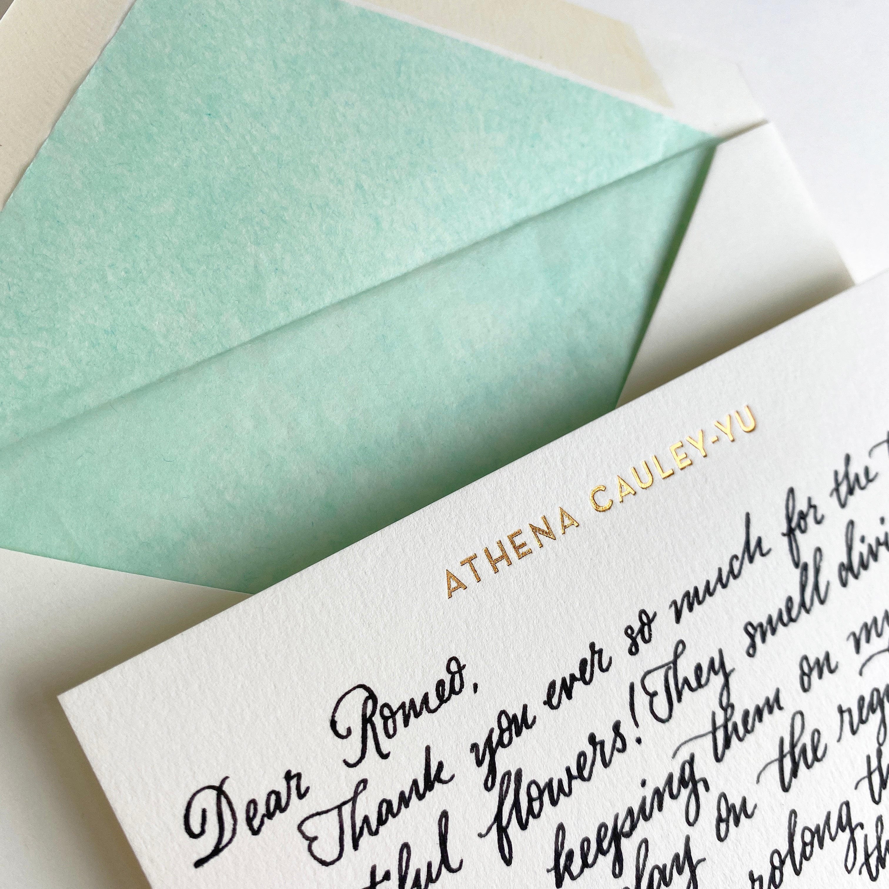 close-up of handwritten note on personalised correspondence cards