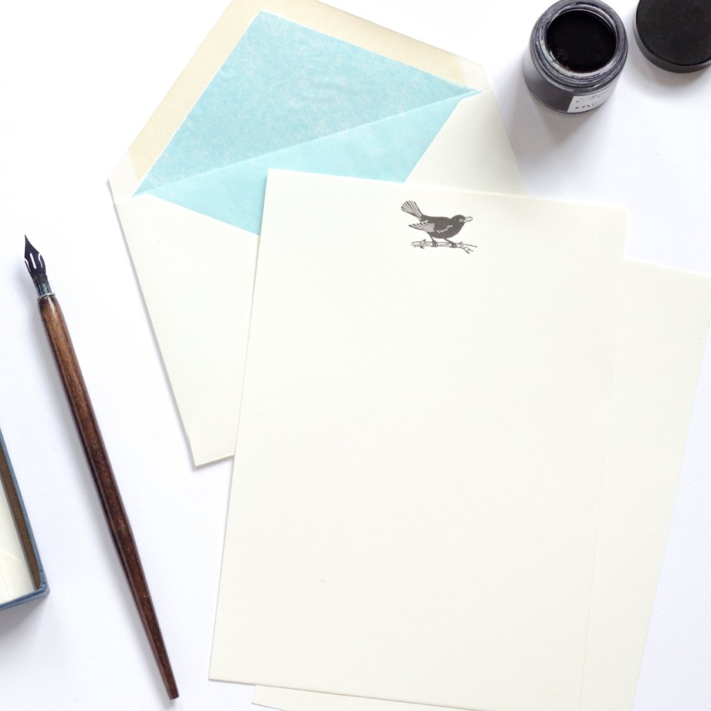 Blackbird Letterpress Letterhead with sky blue lined envelope and ink pot and dip pen