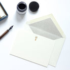 Lightbulb Letterpress Correspondence Card with grey tissue lined envelope and nib and ink pot