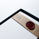 Close-up of plain Correspondence Cards in display box with wax seal