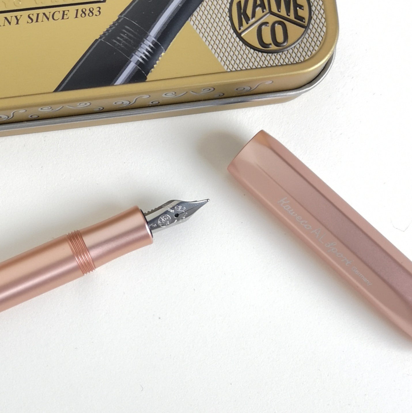 Kaweco Rose Gold Aluminium Fountain Pen with cap and metal display tin