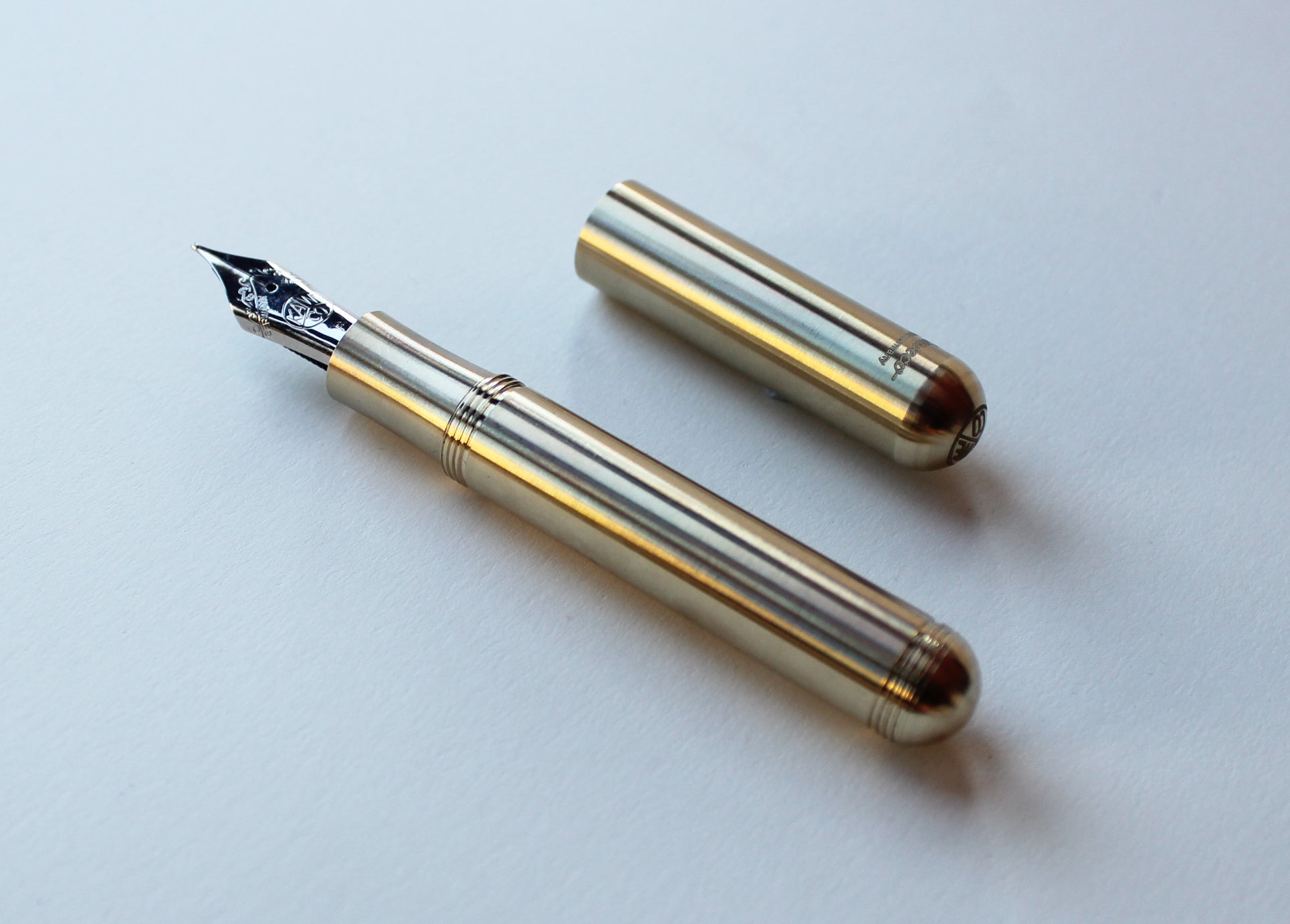 Kaweco Brass Supra Fountain Pen in smallest form with cap by side
