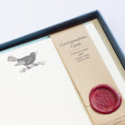 close-up of Blackbird Letterpress Correspondence Cards in display box with wax seal