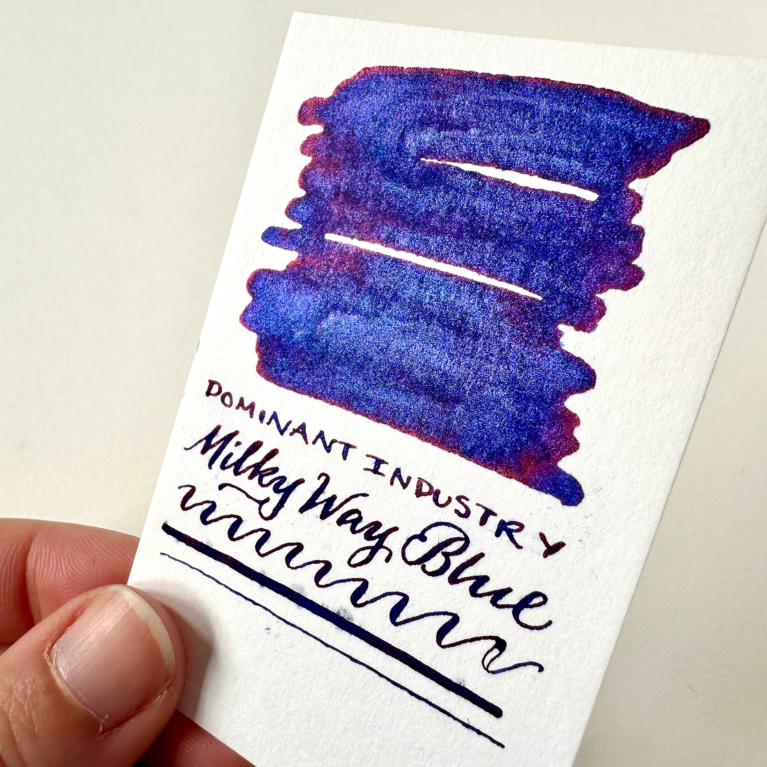 Swatch of Milky Way Blue ink - deep blue ink with a red tinge and metallic sparkle