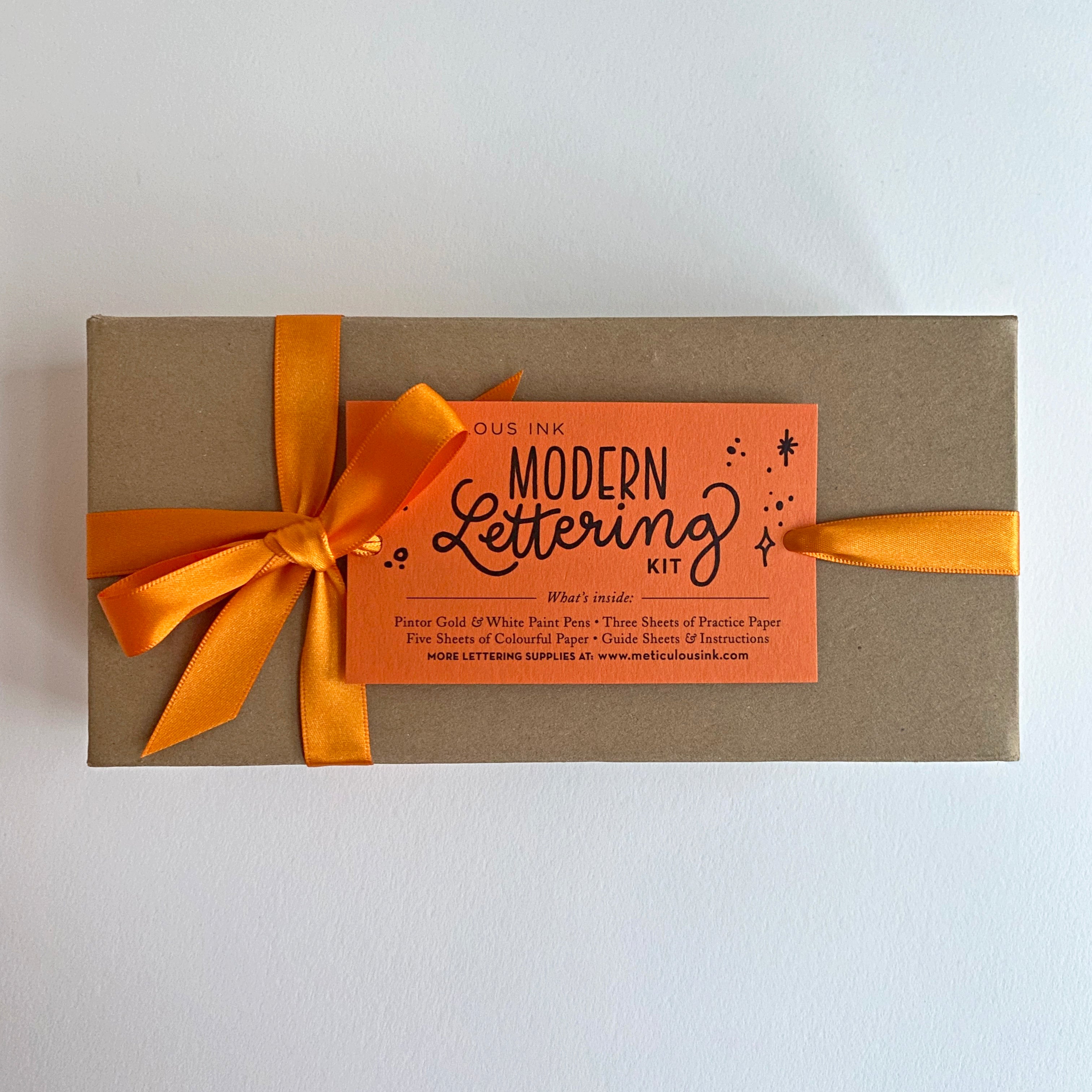 Kraft Box with Orange ribbon and Modern Lettering kit label 