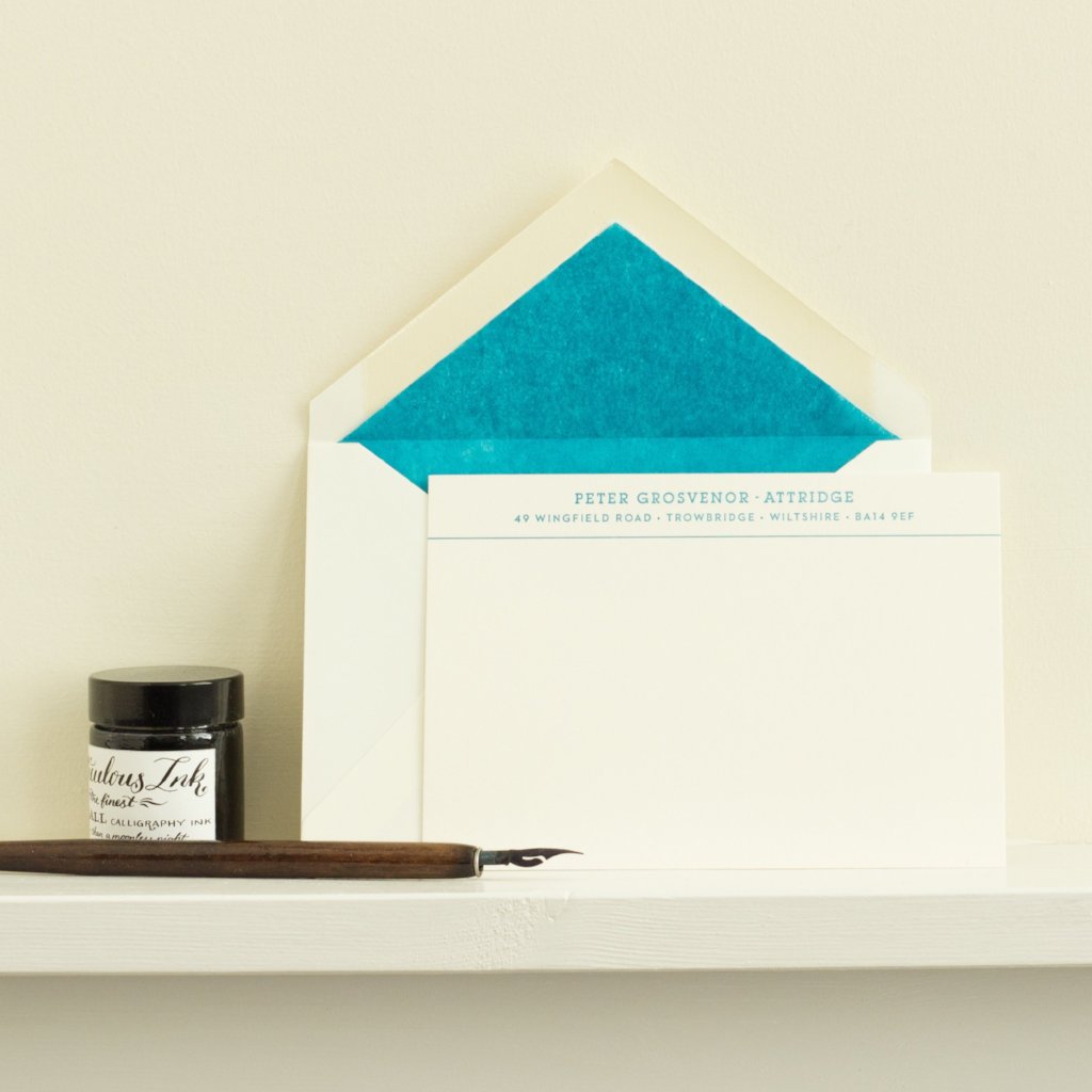 Blue Personalised Letterpress Correspondence Cards on shelf with envelope, dip pen and ink