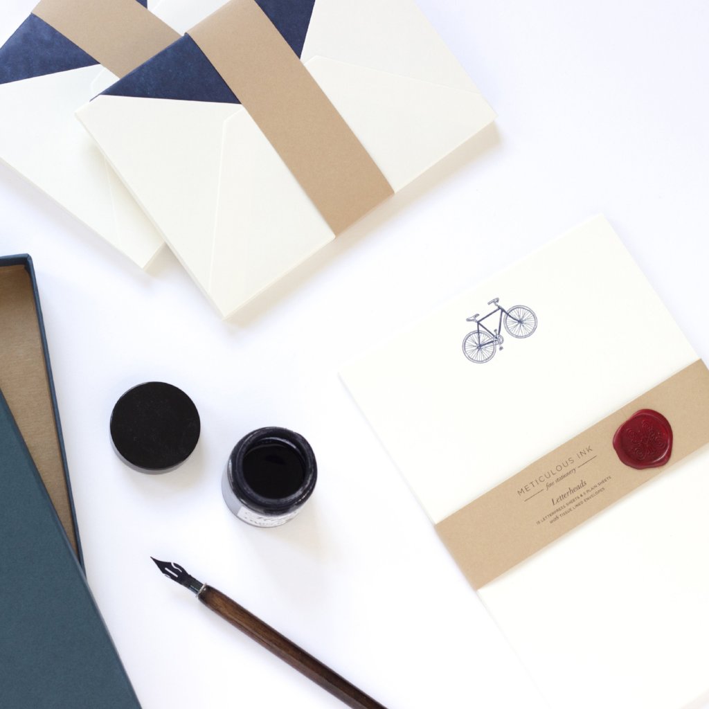 Bicycle Letterpress Letterheads wrapped with wax seal and ink pot by side