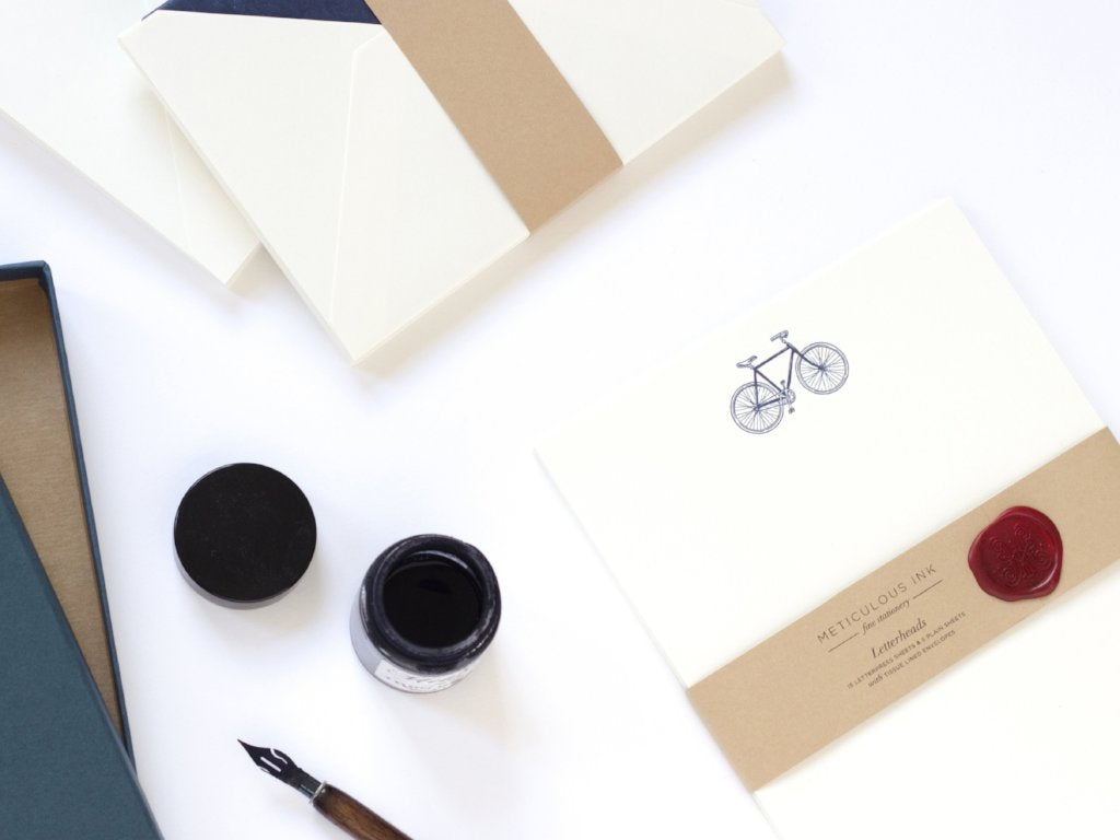 Bicycle Letterpress Letterheads wrapped with wax seal and ink pot by side
