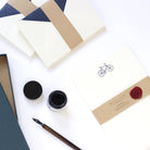 Bicycle Letterpress Letterheads wrapped with wax seal and ink pot by side