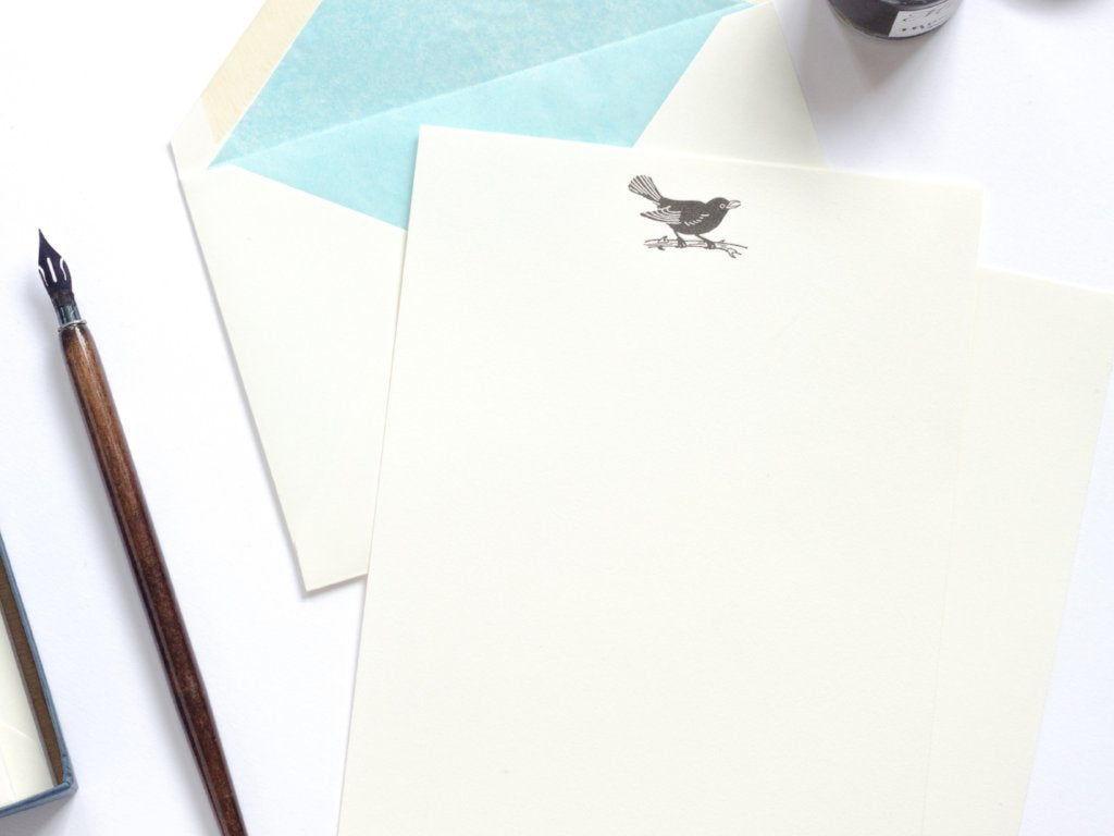 Blackbird Letterpress Letterhead with sky blue lined envelope and ink pot and dip pen