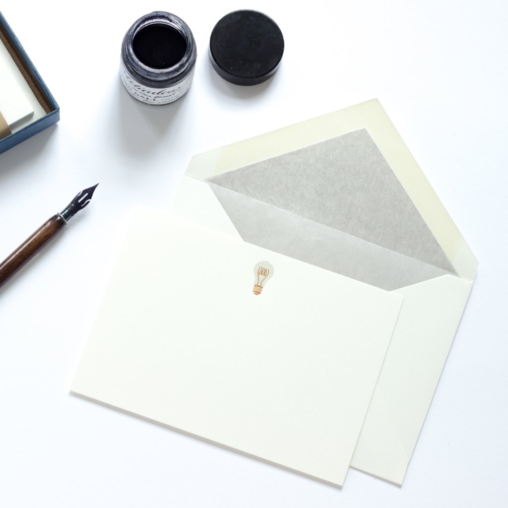 Lightbulb Letterpress Correspondence Card with grey tissue lined envelope and nib and ink pot