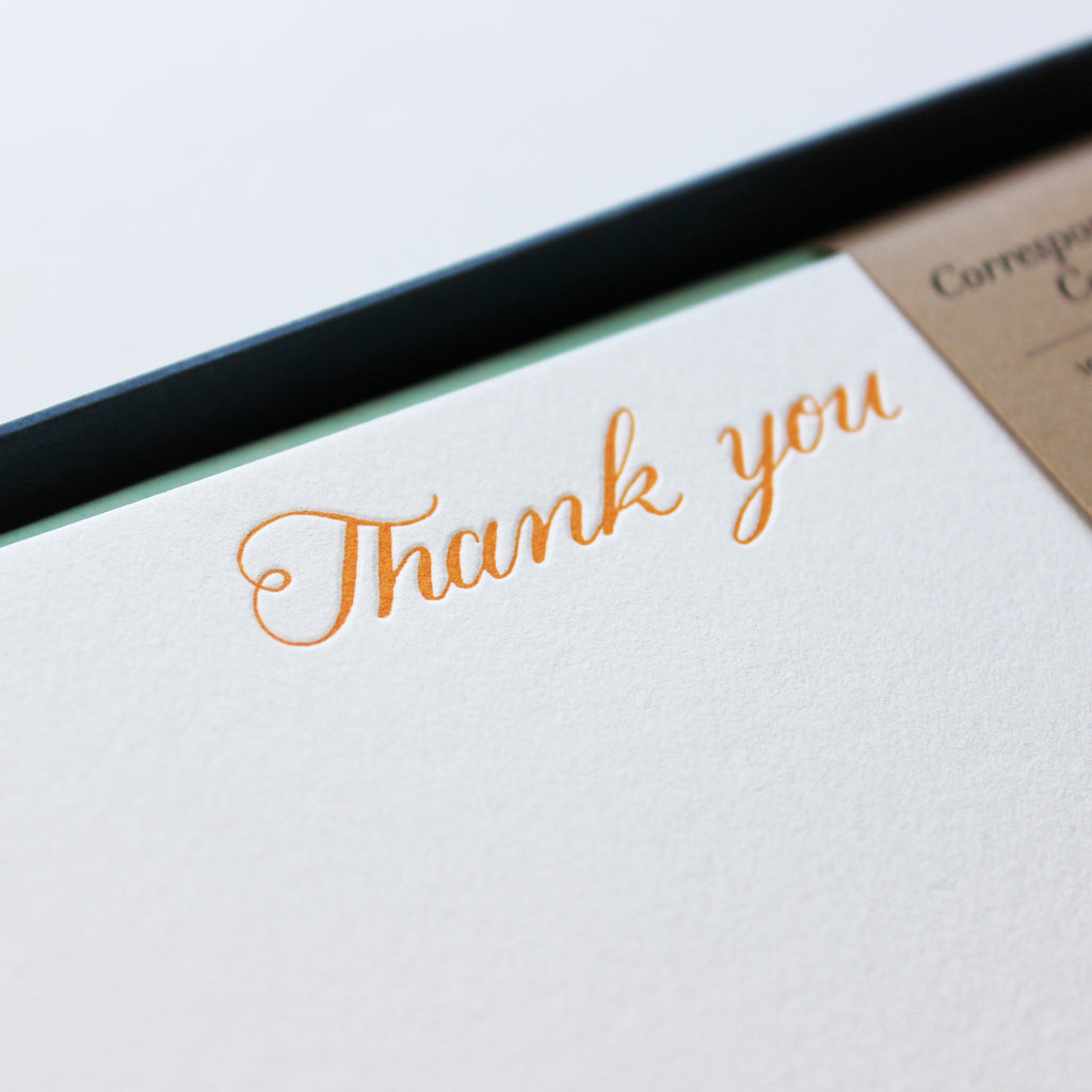 Close-up of Orange Script Thank You Letterpress Correspondence Cards in display box with wax seal