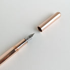 Close-up of Kaweco Copper Liliput Fountain Pen with cap and nib