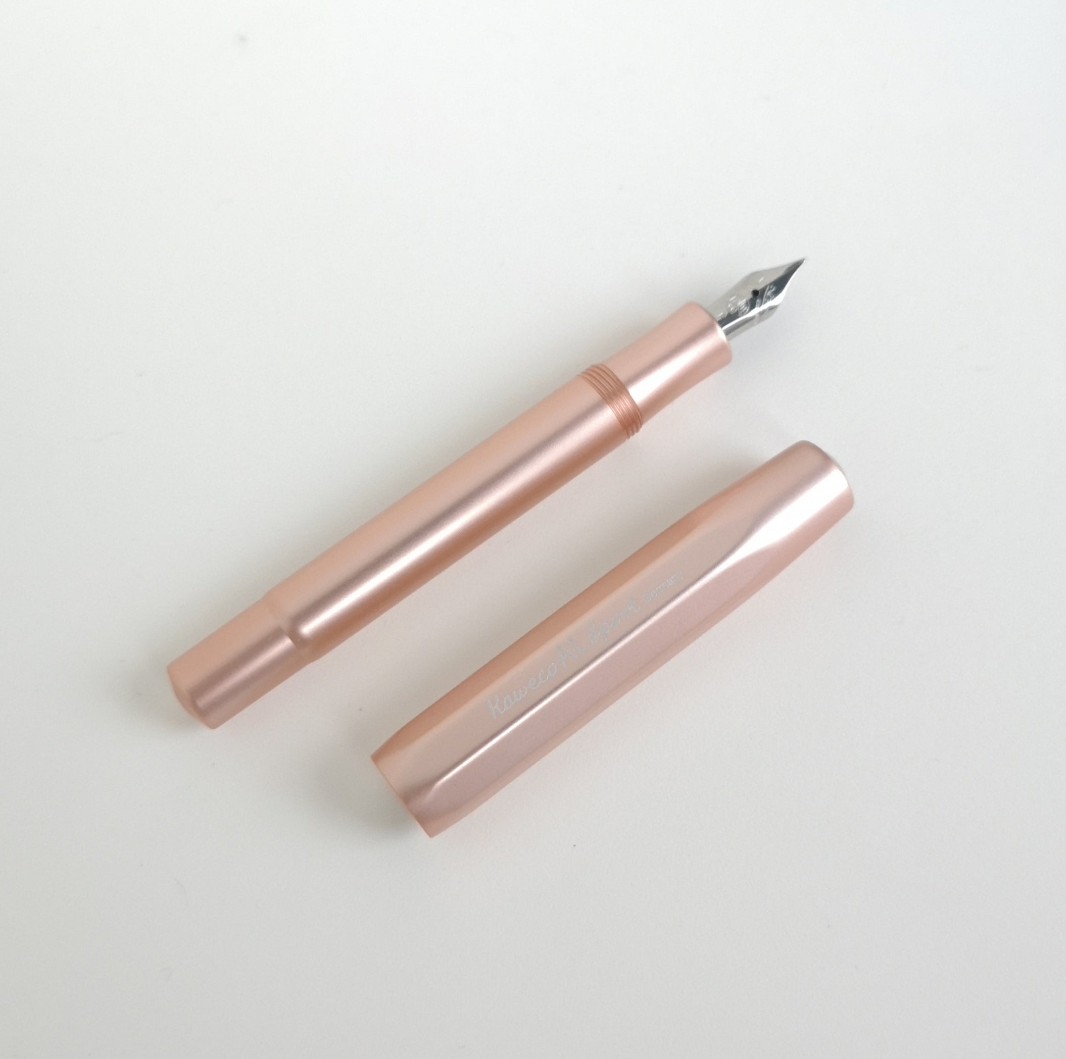Kaweco Rose Gold Aluminium Fountain Pen with cap by side