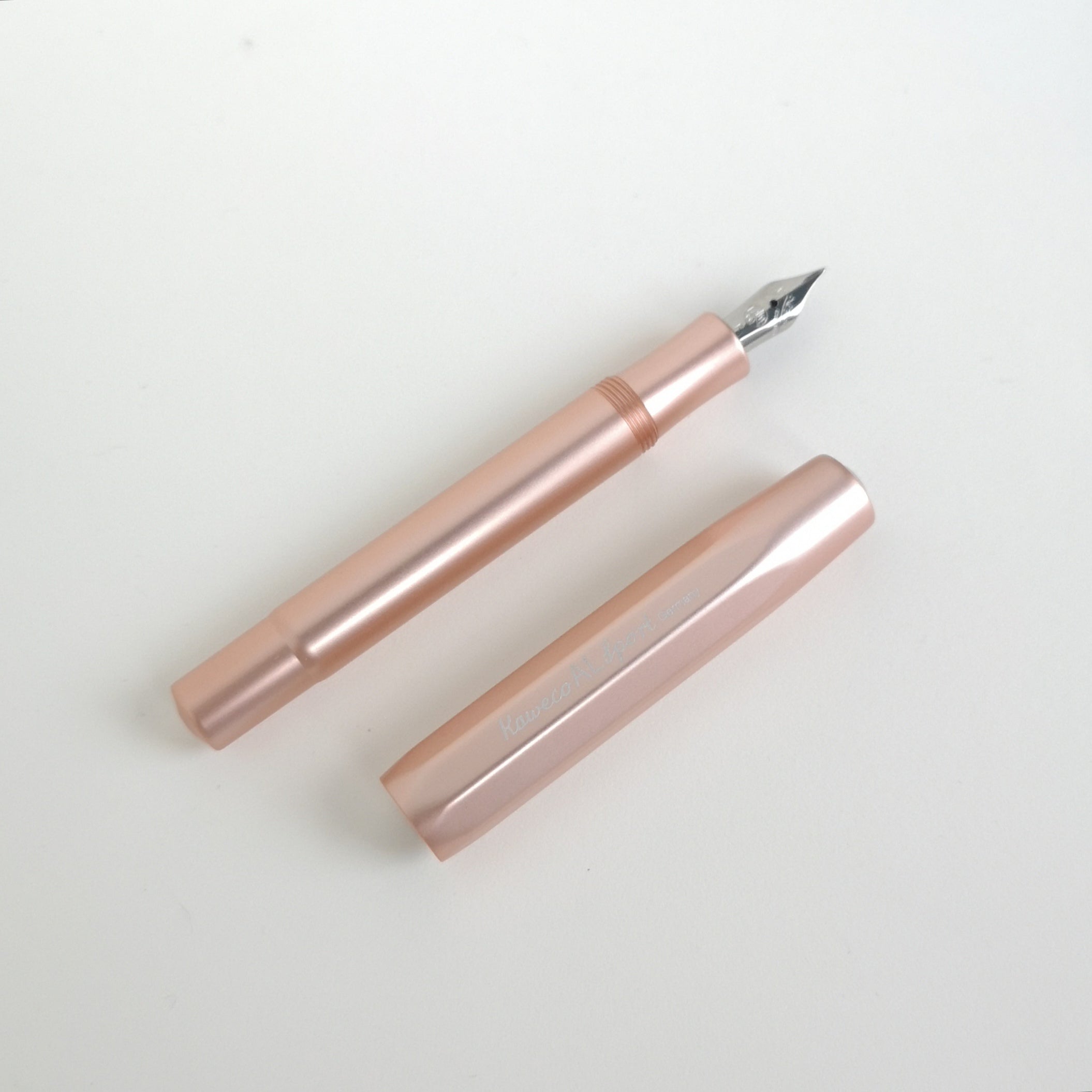 Kaweco Rose Gold Aluminium Fountain Pen with cap by side