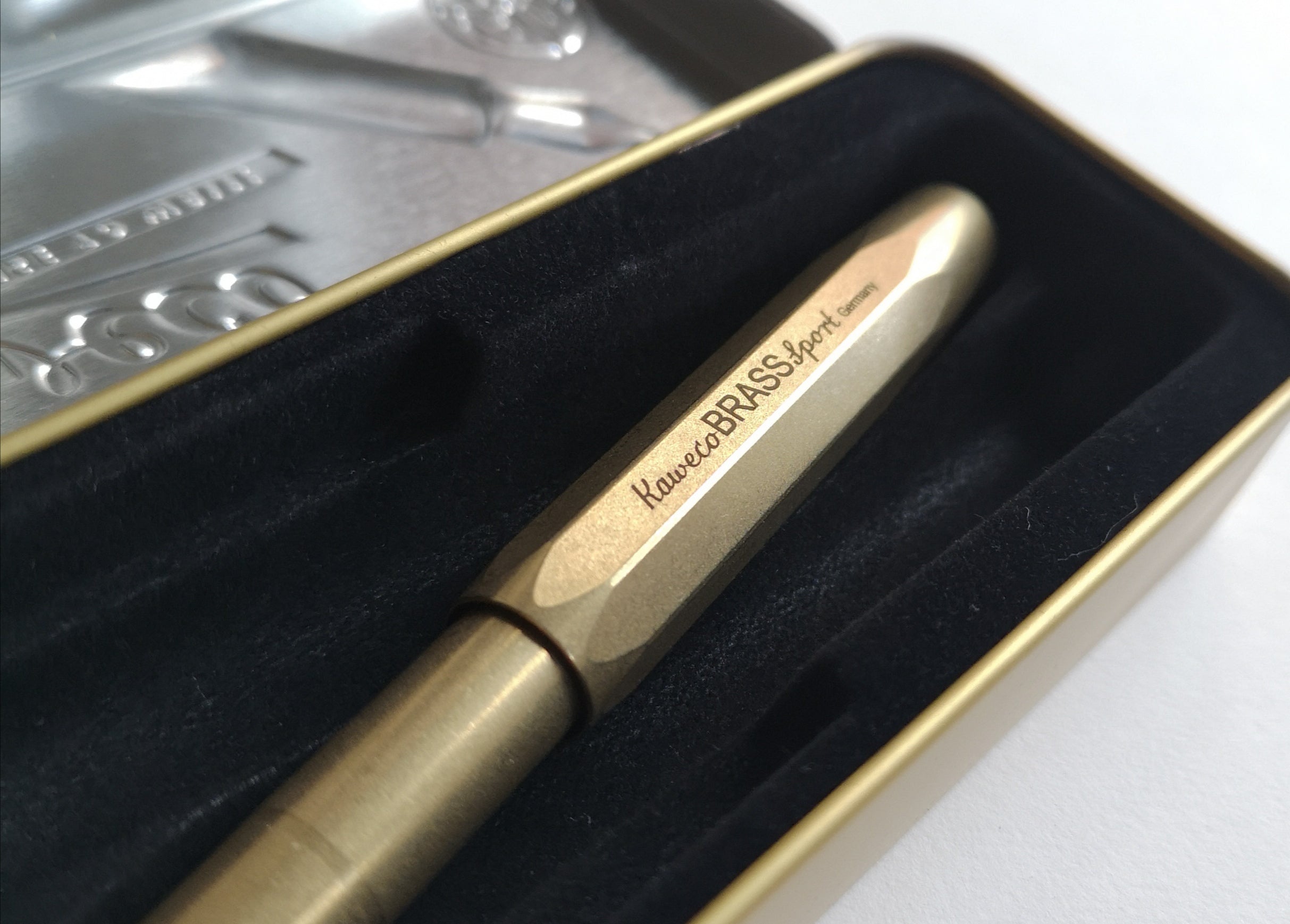kaweco brass sport fountain pen in metal tin close-up