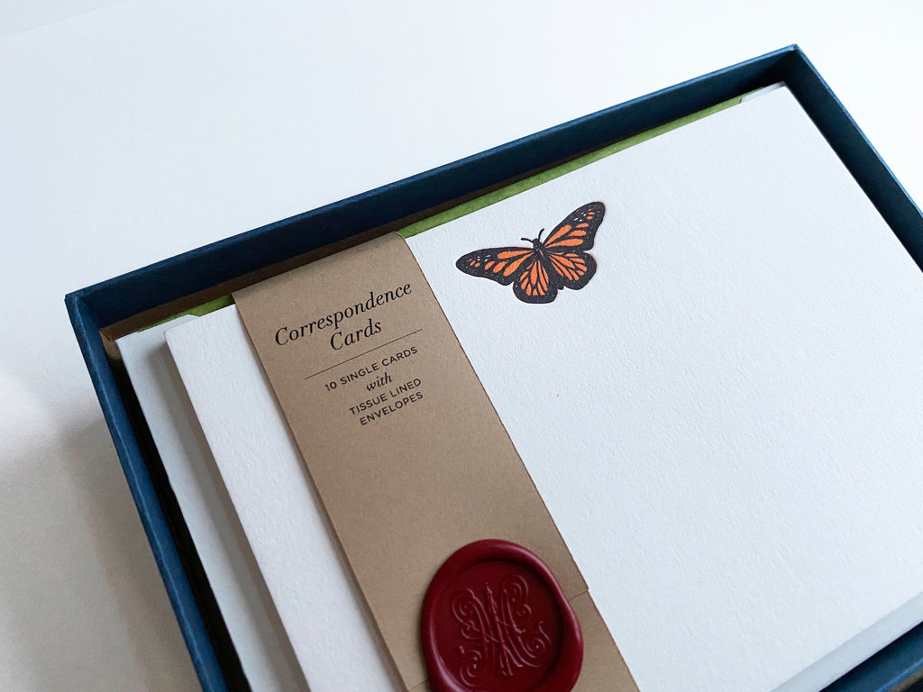 Close-up of Monarch Butterfly Letterpress Correspondence Cards in display box with wax seal