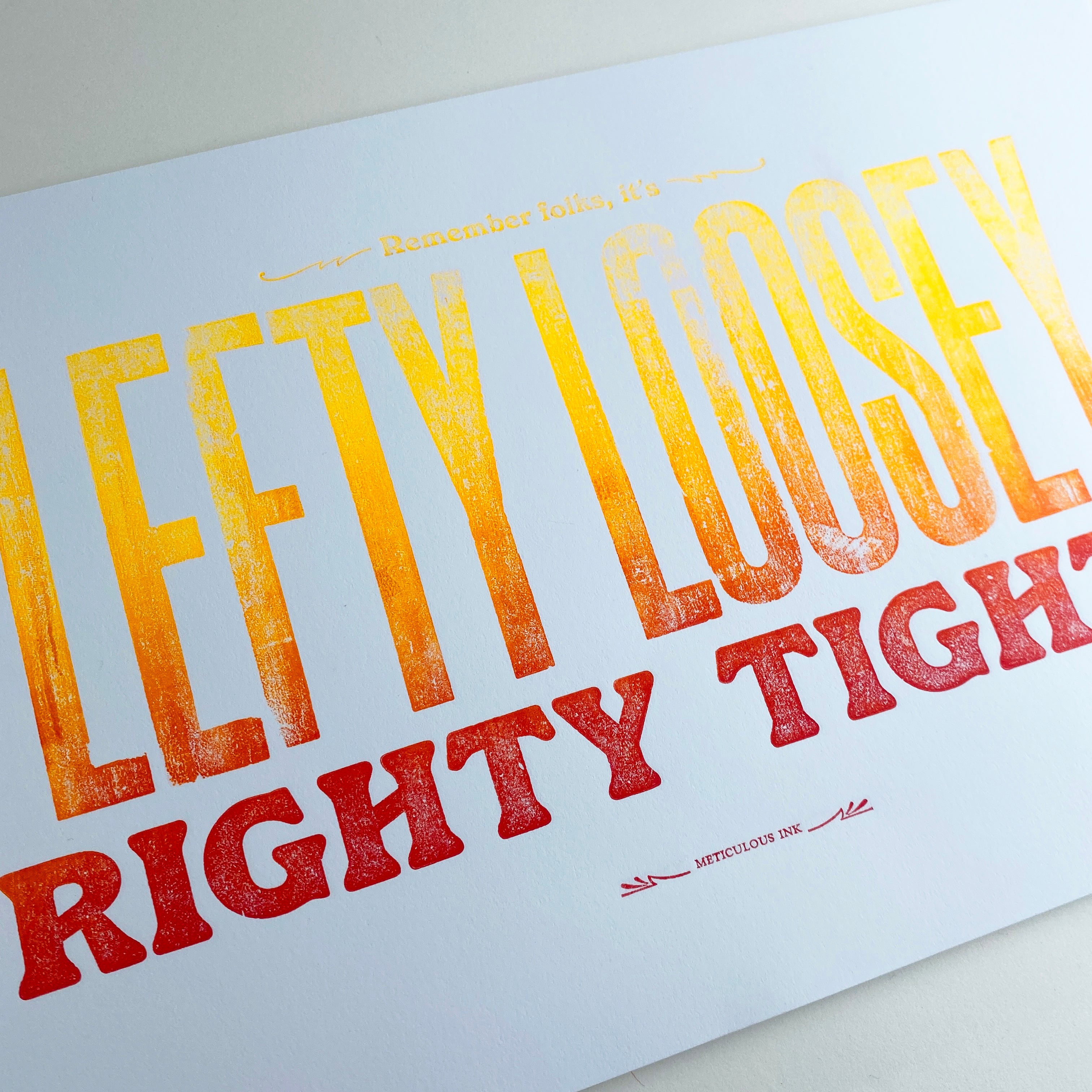 close-up of Meticulous Ink Lefty Loosey Righty Tighty Ombre yellow to red letterpress print