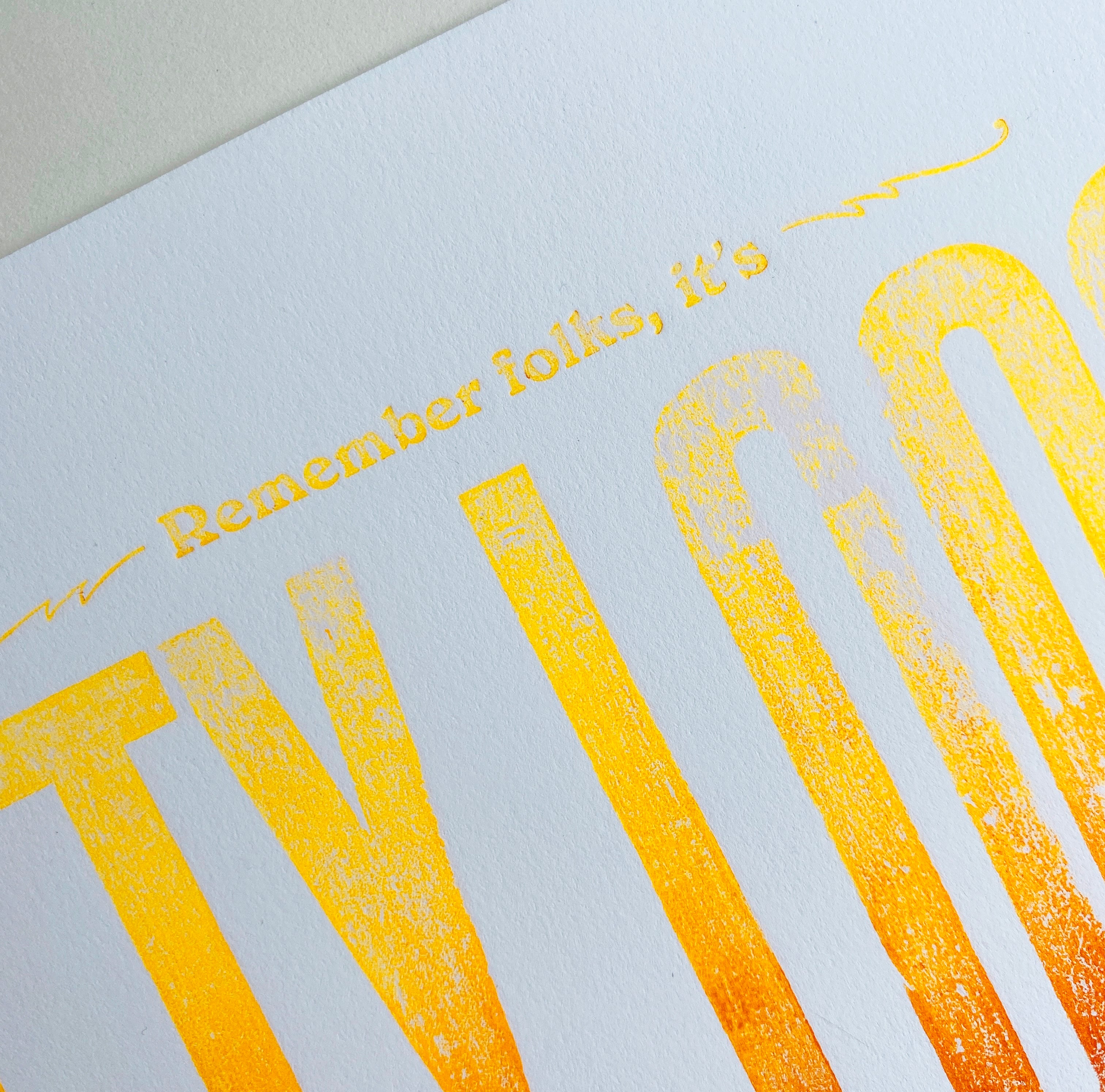 Close-up of 'Remember folks, it's' text on letterpress art print