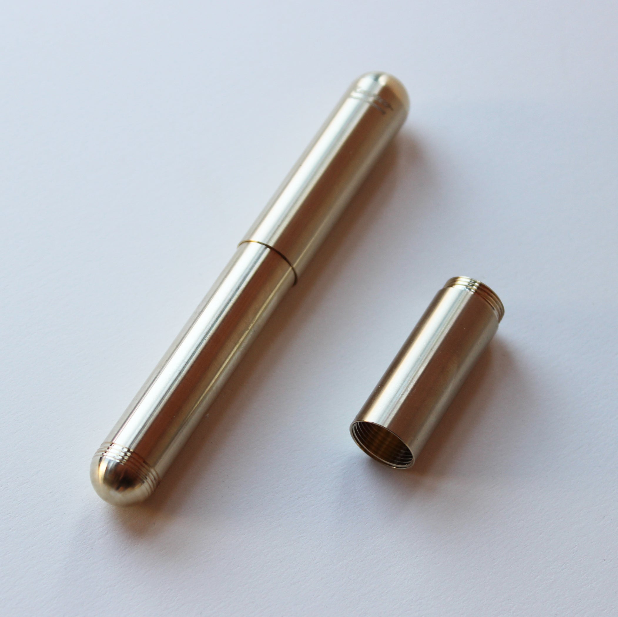 Kaweco Brass Supra Fountain Pen in smallest form with middle out