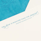 Close-up of letterpress quote blue The Pen is mightier than the Sword by Edward Bulwer-Lytton