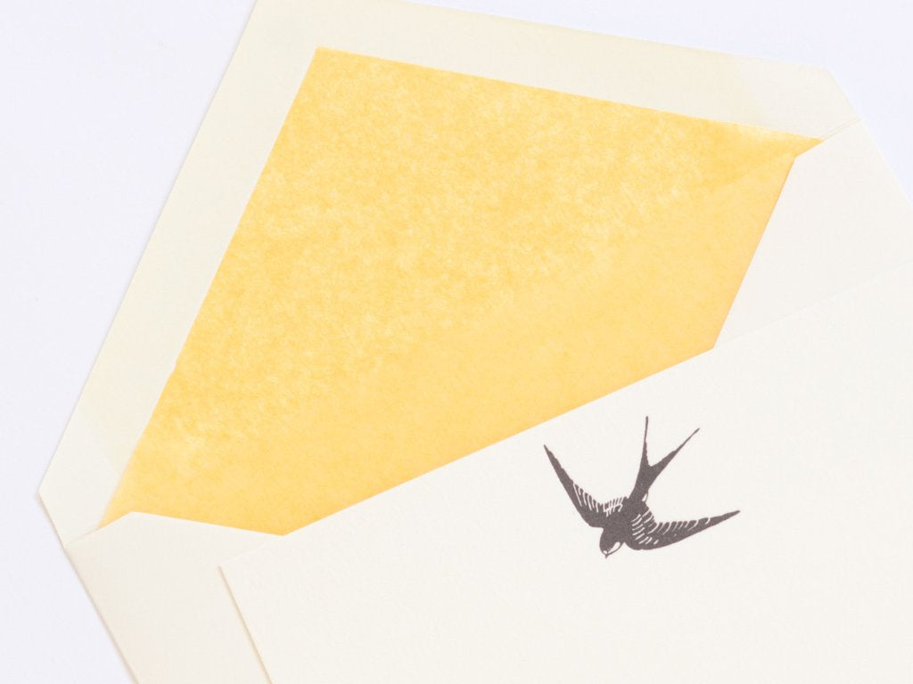 Close-up of Swallow Letterpress Correspondence Card with yellow tissue lined envelope