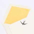 Close-up of Swallow Letterpress Correspondence Card with yellow tissue lined envelope