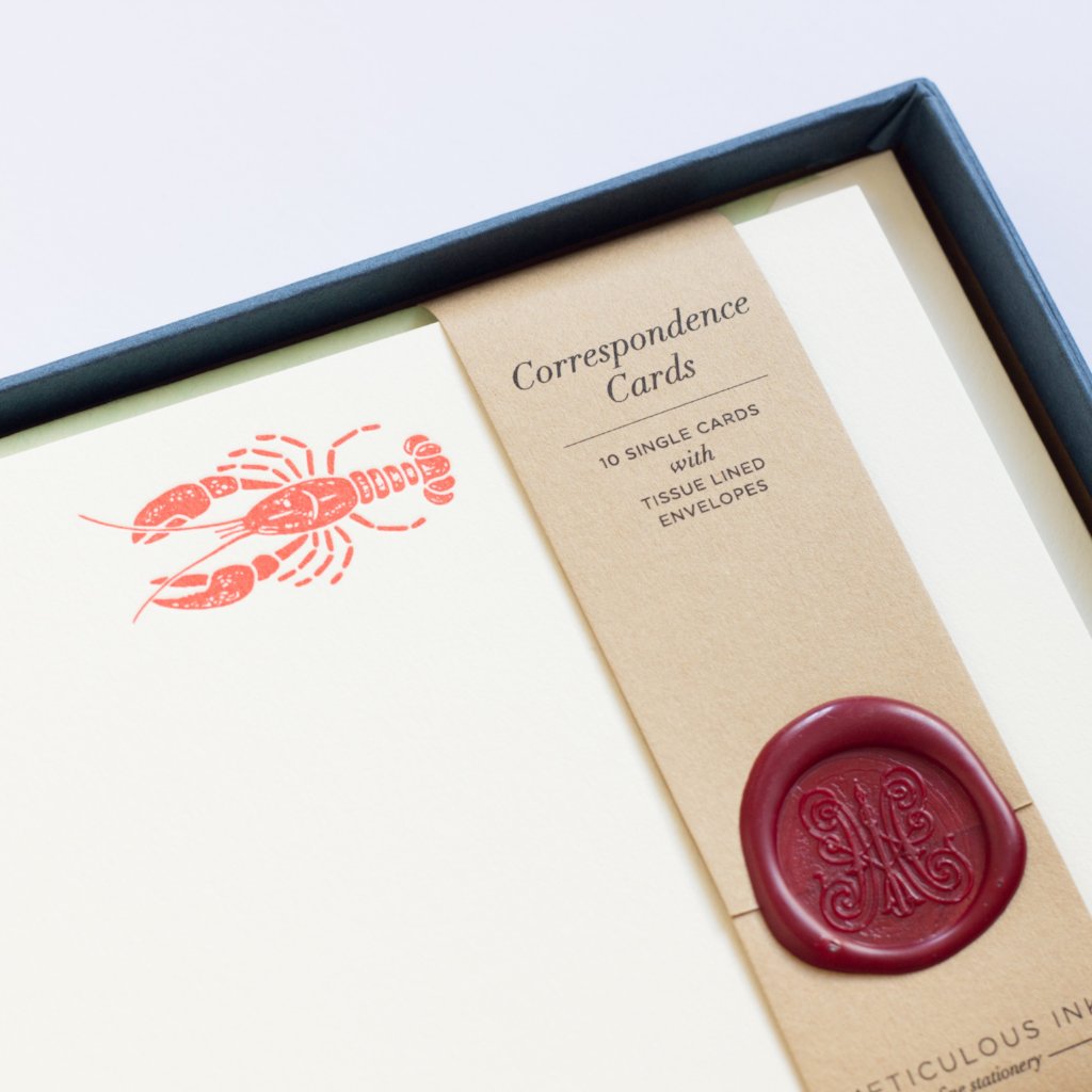 close-up of Lobster Letterpress Correspondence Cards in display box with wax seal