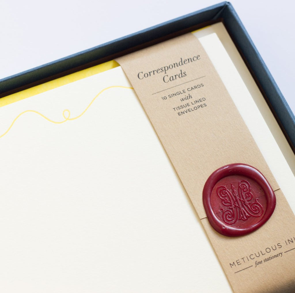 Close-up of Sewing Letterpress Correspondence Cards in display box with wax seal