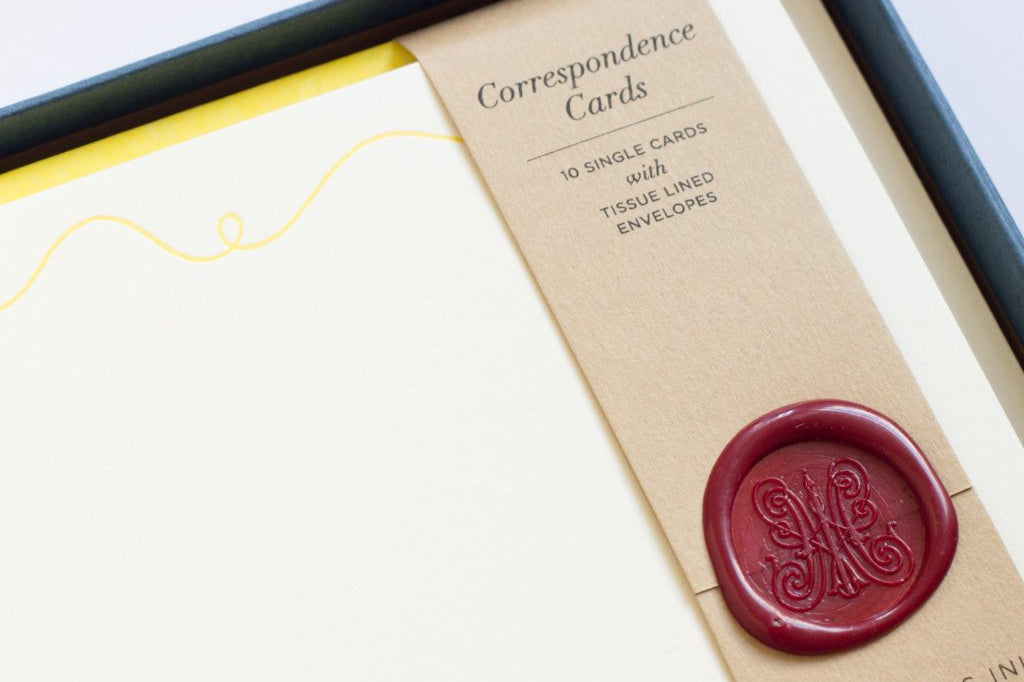 Close-up of Sewing Letterpress Correspondence Cards in display box with wax seal