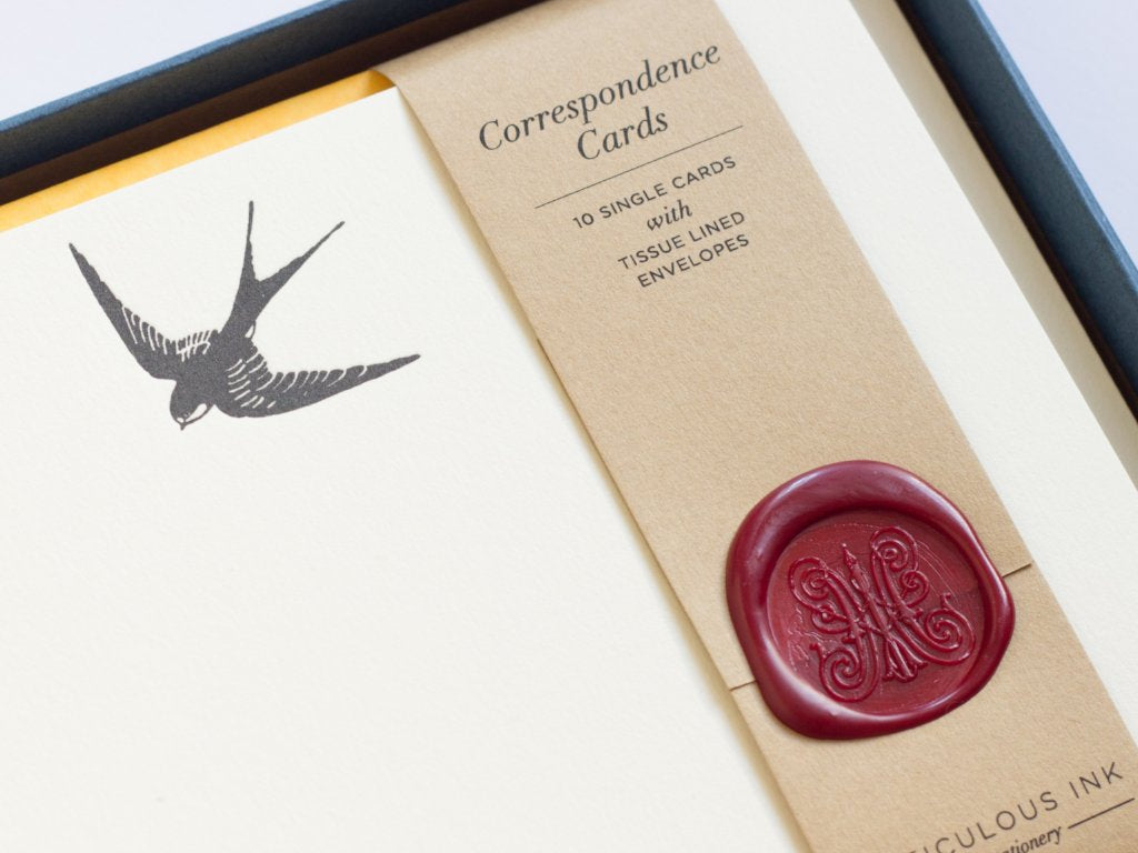Close-up of Swallow Letterpress Correspondence Cards in display box with wax seal