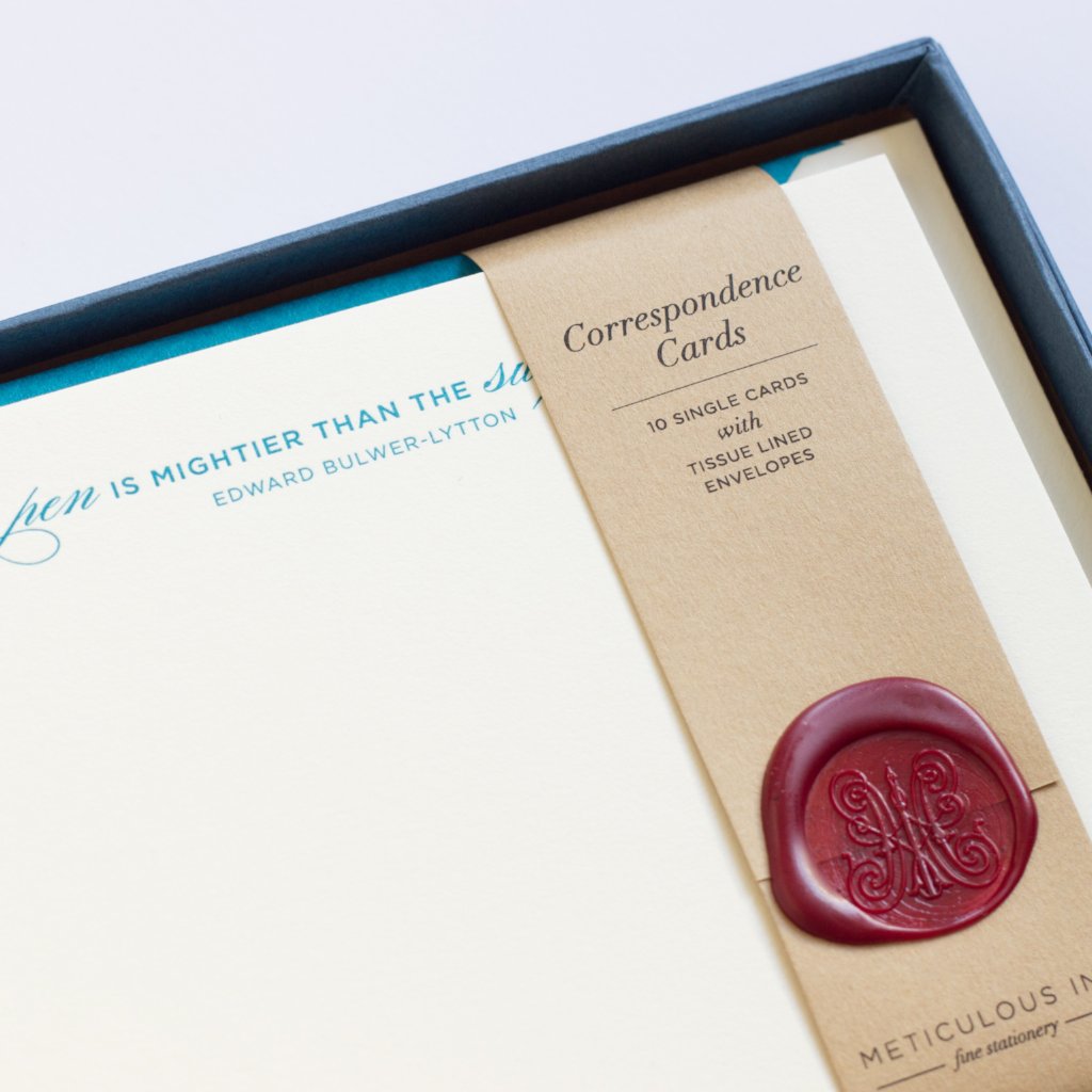 Close-up of Pen is Mightier Letterpress Correspondence Cards in display box with wax seal