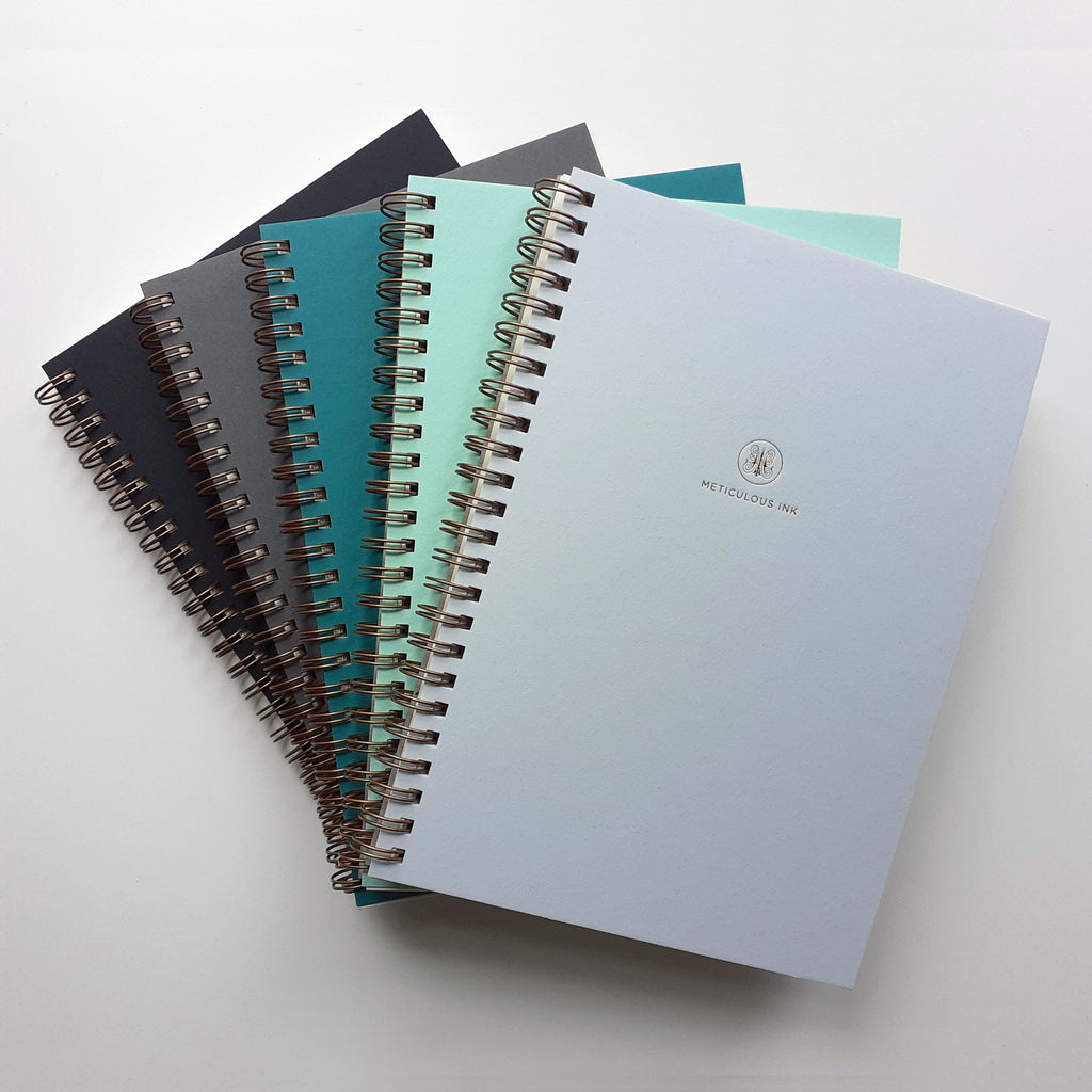 Fan selection of notebooks in blue and grey
